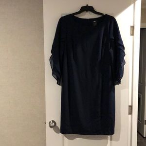 High end navy dress hits below the knees, flowy 3/4 length sleeves.